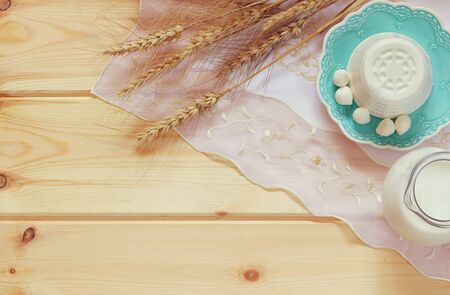image of dairy products on wooden background. Symbols of jewish holiday - Shavuotの写真素材