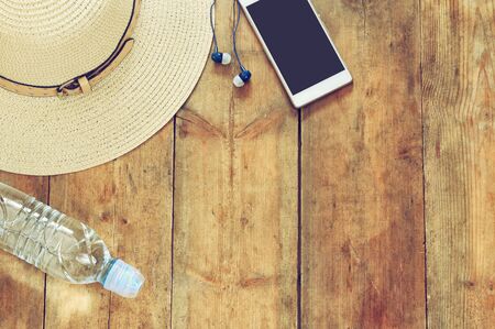 top view image of summer accessories on wooden deck. retro filteredの写真素材