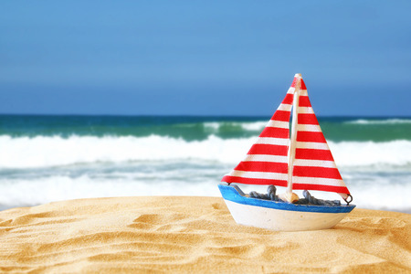Image of tropical sandy beach and sailboat. Summer concept.の写真素材
