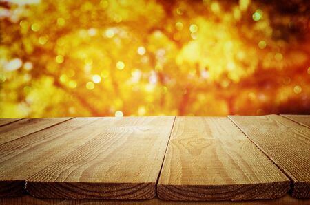 Empty table in front of blurry autumn background.の写真素材