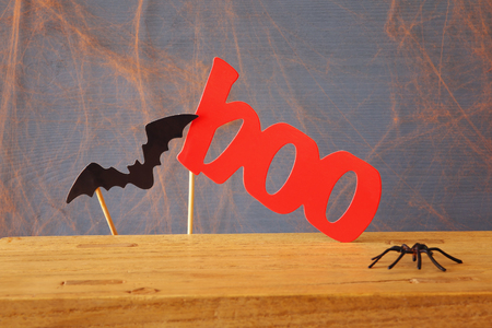 Halloween holiday concept. Funny paper bat and word BOOの写真素材