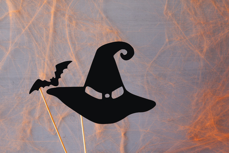 Halloween holiday concept. Funny paper witch hat and the batの写真素材