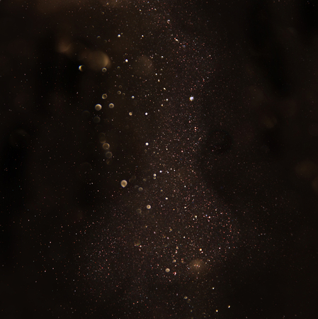glitter vintage lights background. dark gold and black. de focusedの写真素材