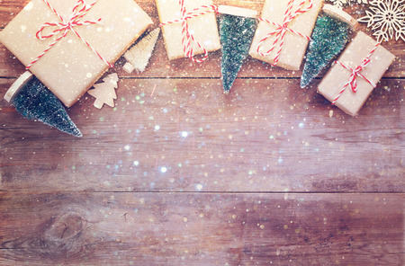 Flat lay image of handmade gift boxes over wooden backgroundの写真素材