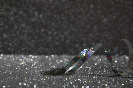 Abstract image of christmas festive ribbon decoration with glitter backgroundの写真素材