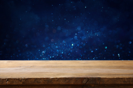 Empty table in front of blue glitter lights background. For product display montageの写真素材