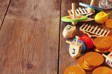 Image of jewish holiday Hanukkah with wooden dreidels (spinning top)の写真素材
