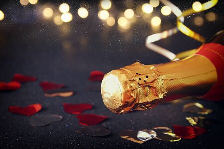 Abstract image of champagne bottle and festive lights. New year and celebration conceptの写真素材