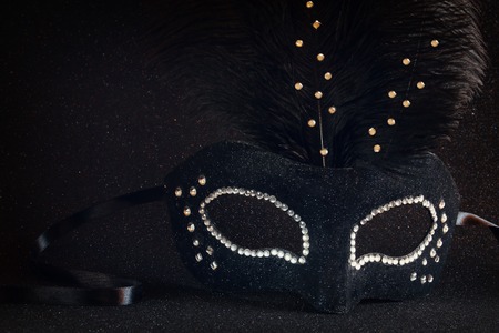 Image of black elegant venetian mask on glitter backgroundの写真素材