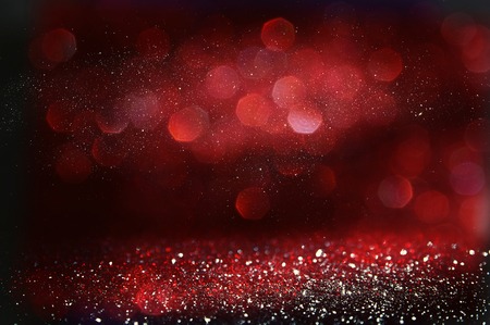 Red and black glitter vintage lights background. defocusedの写真素材