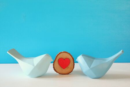 Couple of Lovebirds on wooden table.の写真素材