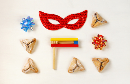 Purim celebration concept (jewish carnival holiday). Top view on white backgroundの写真素材