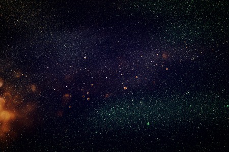 glitter vintage lights background. gold, green and black. de-focusedの写真素材