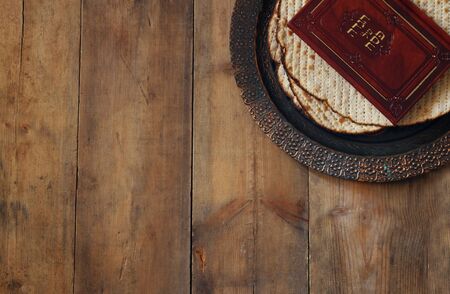 Pesah celebration concept (jewish Passover holiday). Traditional book with text in hebrew: Passover Haggadah (Passover Tale)の写真素材