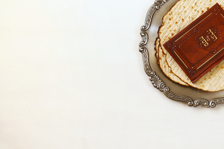 Pesah celebration concept (jewish Passover holiday). Traditional book with text in hebrew: Passover Haggadah (Passover Tale)の写真素材