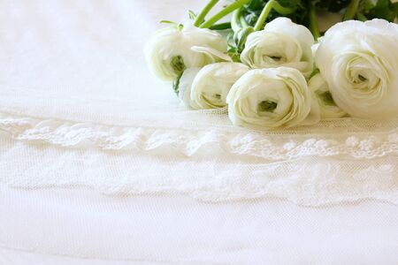 Background of white delicate lace fabric.の写真素材