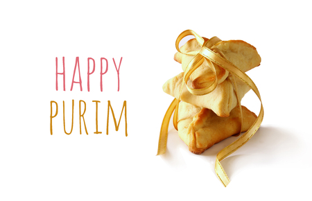 Purim celebration concept (jewish carnival holiday). Traditional cookie isolated on whiteの写真素材