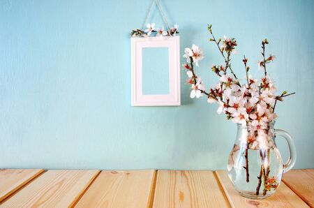 spring white flowers on wooden tableの写真素材