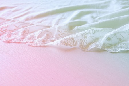 Background of white delicate lace fabric.の写真素材