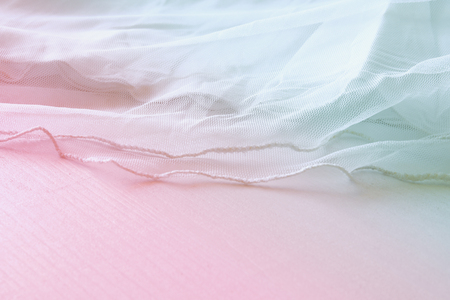 Background of white delicate lace fabric.の写真素材