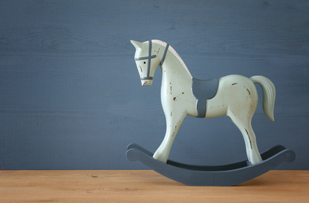 vintage rocking horse on wooden floor.の写真素材