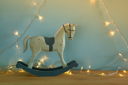 vintage rocking horse on wooden floor. Filtered imageの写真素材