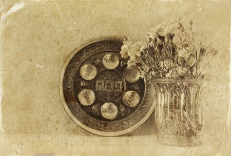 Pesah celebration concept (jewish Passover holiday). Vintage style filtered and textured imageの写真素材