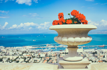 image of balcony view of marina , old flower vase and blue sky.の写真素材