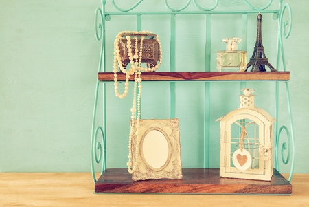 Classic shelf with vintage objects and blank frame. Ready to put photographyの写真素材