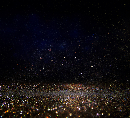 glitter vintage lights background. gold and black. de-focused.の写真素材