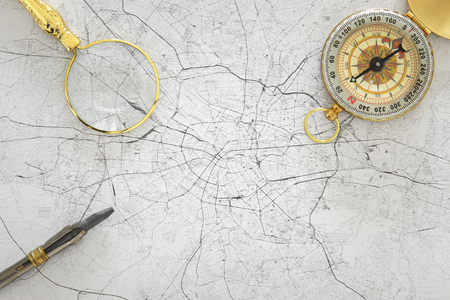 Image of map, magnifying glass and old compass. selective focus. travel destination conceptの写真素材