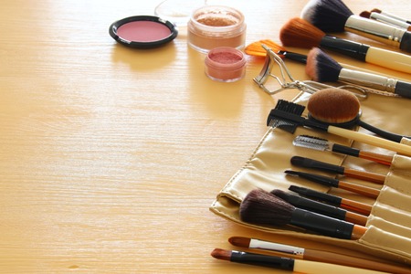 Image of makeup cosmetics beauty tools and brushes on wooden backgroundの写真素材