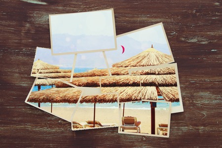 top view of tropical photo collage on wooden background. vintage filtered imageの写真素材