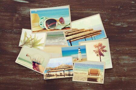 top view of tropical photo collage on wooden background. vintage filtered imageの写真素材