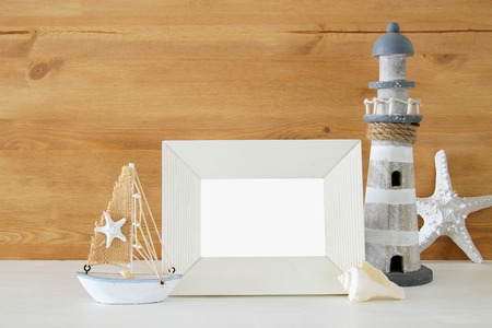 Nautical concept with sea life style objects on wooden table. For photography montage.