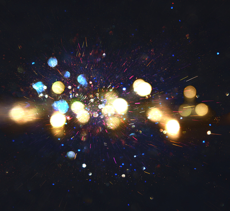 glitter vintage lights background. gold, blue and black. defocused.の写真素材
