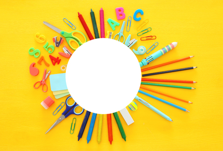 Back to school concept on yellow wooden background. Top viewの写真素材