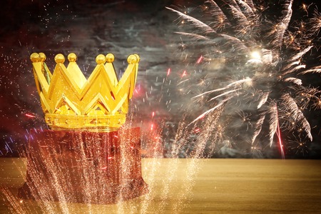 image of golden crown award over wooden table. Glitter overlayの写真素材