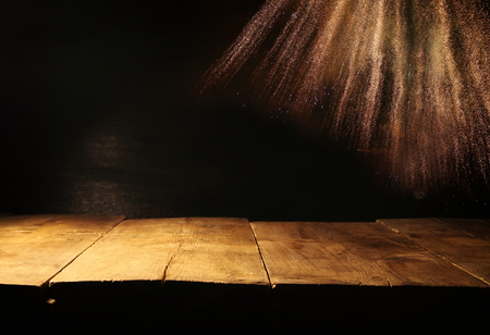 Empty table in front of black and gold glitter lights background. For product display montageの写真素材