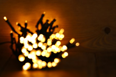glitter garland lights background. gold and black. de-focused