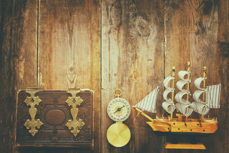 Columbus day concept with old ship over wooden background.の写真素材