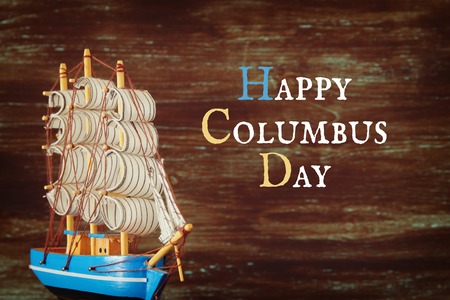 Columbus day concept with old ship over wooden background.の写真素材