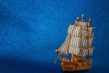 Columbus day concept with old ship over blue glitter background.の写真素材