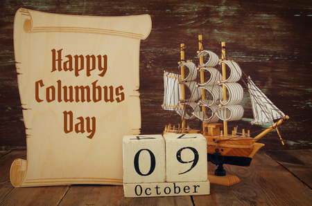Columbus day concept with old ship over wooden background.の写真素材