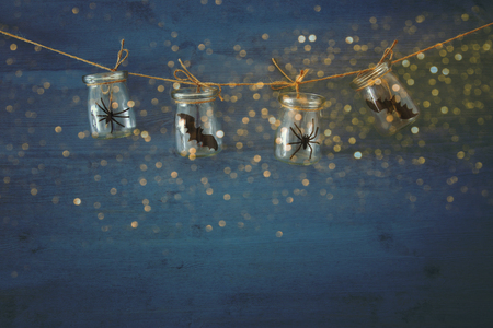Halloween holiday concept. Masson jars with spiders, baths.の写真素材