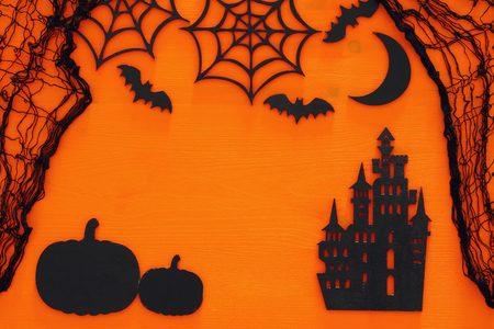 Halloween holiday concept top view scene over wooden orange background.の写真素材