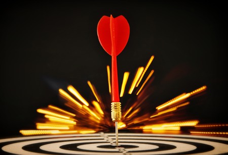 Red darts arrows in the target center.の写真素材