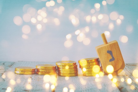 jewish holiday Hanukkah image background with traditional spinnig top and chocolate coins. Glitter overlayの写真素材