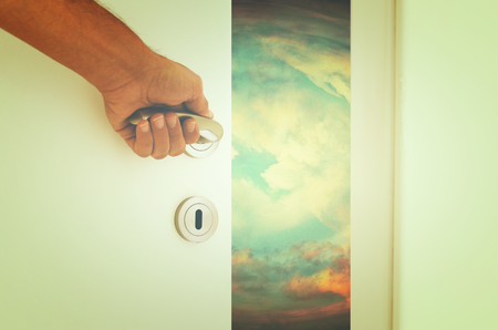 image of open door to the sunset mysterious sky. vintage filtered.の写真素材