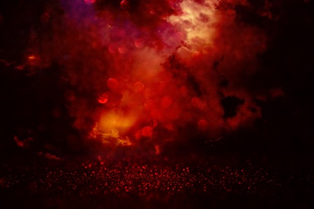 black and red glitter lights background. defocused.の写真素材